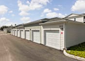 Thumbnail 31 of 61 - A long row of garages at Verity Luxury Apartments, Florida