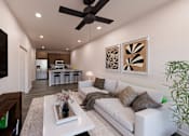 Thumbnail 4 of 13 - A modern living room with a white couch and a large flat screen TV mounted on the wall at Verity Luxury Apartment Homes Apartments, Florida, 32960