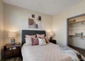 Thumbnail 13 of 38 - a bedroom with a large bed and two night stands with lamps  at Upland Flats, Colorado Springs