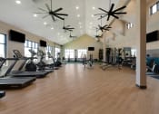 Thumbnail 33 of 38 - a spacious fitness center with treadmills and other exercise equipment  at Upland Flats, Colorado Springs, CO, 80922