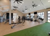 Thumbnail 34 of 38 - a spacious fitness center with treadmills and other exercise equipment  at Upland Flats, Colorado Springs, CO