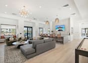 Thumbnail 30 of 108 - a living room with couches and chairs and a dining room table at The Maddox Luxury Apartment Homes, Arizona  