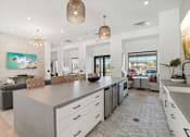 Thumbnail 31 of 108 - a rendering of the lobby of a store with a shark on the wall at The Maddox Luxury Apartment Homes, Arizona, 85326 