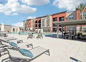 Thumbnail 33 of 108 - our apartments at the district feature a pool and lounge areas at The Maddox Luxury Apartment Homes, Buckeye, AZ  