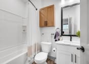 Thumbnail 44 of 58 - a small bathroom with a toilet and a sink at Meridian at CityPlace, Minnesota