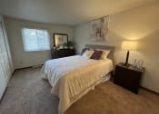 Thumbnail 6 of 15 - a bedroom with a bed and two night standsat Holiday Park Apartments, Pennsylvania