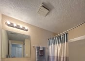 Thumbnail 21 of 36 - a bathroom with a toilet sink and bathtub at Deauville Park Apartments, Pennsylvania, 15146