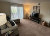 Thumbnail 7 of 36 - a living room with a couch and a tv at Deauville Park Apartments, Monroeville, 15146