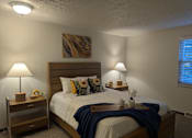 Thumbnail 4 of 18 - A bedroom with a bed, nightstands, and lamps.