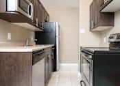 Thumbnail 5 of 8 - Kitchen at 16 Edmonton Apartment Suites for Students in Winnipeg
