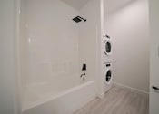 Thumbnail 61 of 77 - Modern Bathroom with In-suite Laundry at 703 St. Anne's Road Apartments, Winnipeg, MB