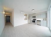 Thumbnail 58 of 77 - Kitchen and Living Area With Modern Finishings at 703 St. Anne's Road Apartments, Winnipeg, MB