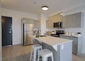 Thumbnail 45 of 77 - Modern Kitchen With Bar Counter at 703 St. Anne's Road Apartments, Winnipeg, MB