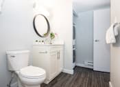 Thumbnail 26 of 33 - a white bathroom with a toilet and a sink