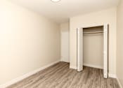 Thumbnail 15 of 40 - A room with a white door and a white ceiling light.