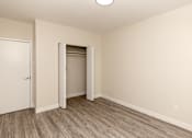 Thumbnail 17 of 40 - A room with a white door and a white wall.