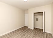 Thumbnail 18 of 40 - A room with a white door and a light on the ceiling.