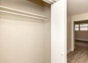 Thumbnail 20 of 40 - A room with a window and a door.