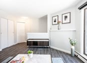 Thumbnail 10 of 33 - a living room with white walls and a large window
