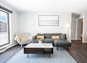 Thumbnail 2 of 33 - a living room with a couch and a coffee table