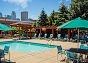Thumbnail 3 of 25 - Immerse yourself in the tranquil oasis of our outdoor heated pool at Mill City Apartments.