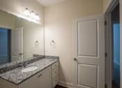 Thumbnail 17 of 25 - Bathroom vanity and toilet at The Retreat at Sumter Apartments, South Carolina, 29150
