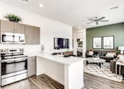 Thumbnail 2 of 18 - Living Room With Kitchen Viewat Avilla Camelback Ranch, Phoenix, AZ