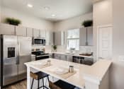 Thumbnail 2 of 11 - Gourmet Kitchen with Island at Avilla Eastlake, Thornton, CO 80241