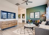 Thumbnail 2 of 15 - Living Room With Television at Avilla Centerra Crossings, Goodyear, AZ, 85338