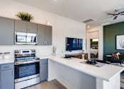 Thumbnail 3 of 15 - Fully Furnished Kitchen With Stainless Steel Appliances at Avilla Centerra Crossings, Goodyear, 85338