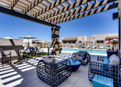 Thumbnail 12 of 15 - Poolside Lounge Area at Avilla Centerra Crossings, Goodyear