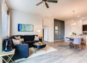 Thumbnail 5 of 13 - Living Room With Dining Area at Avilla Lehi Crossing, Arizona