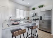 Thumbnail 3 of 24 - Gourmet Kitchen With Island at Avilla Gateway, Phoenix, Arizona