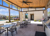 Thumbnail 8 of 13 - Outdoor Lounge + Grill Area at Avilla Magnolia, Phoenix, AZ 85043