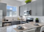 Thumbnail 5 of 8 - Gourmet Kitchen with Island at Avilla Traditions, Grand Prairie, TX 75052