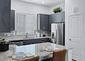 Thumbnail 1 of 10 - Gourmet Kitchen with Island at Avilla Berry Creek Highlands, Georgetown, TX 78633
