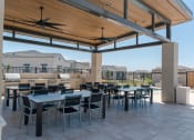 Thumbnail 10 of 13 - Outdoor Lounge + Grill Area at Avilla Grand, El Mirage, AZ 85335