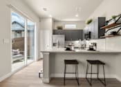 Thumbnail 16 of 22 - Gourmet Kitchen with Island at Avilla Berry Creek Highlands, Georgetown, TX 78633