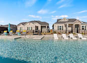 Thumbnail 14 of 19 - Resort-style pool and lounging at Avilla Lakeridge in Arlington, TX 76002.