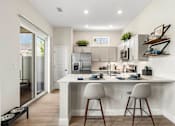 Thumbnail 12 of 16 - Gourmet Kitchen with Island at Avilla Cypress Creek, Sun City Center, FL 33573