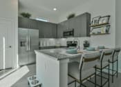 Thumbnail 3 of 9 - Gourmet Kitchen with Island at Avilla Vista Ranch, Liberty Hill, TX 78642