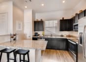 Thumbnail 6 of 14 - Fitted Kitchen With Island Dining at Avilla Northside, Texas, 75071