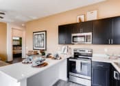 Thumbnail 12 of 12 - Electric Range In Kitchen at Avilla Deer Valley, Arizona, 85085