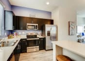 Thumbnail 6 of 12 - Fully Equipped Kitchen With Modern Appliances at Avilla Deer Valley, Phoenix, 85085