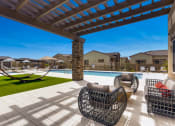Thumbnail 9 of 13 - Poolside Lounge Area at Avilla Lehi Crossing, Mesa, AZ