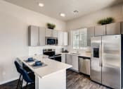 Thumbnail 2 of 13 - Gourmet Kitchen With Island at Avilla Buffalo Run, Colorado, 80022
