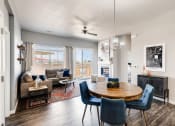 Thumbnail 8 of 13 - Dining Room & Living Room at Avilla Buffalo Run, Commerce City, CO