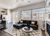 Thumbnail 11 of 13 - Living Room With Kitchen View at Avilla Buffalo Run, Commerce City, CO