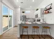 Thumbnail 15 of 18 - Gourmet Kitchen with Island at Avilla Palomino, Glendale, AZ 85302