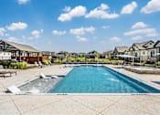 Thumbnail 7 of 23 - Pool with Relaxing Chairs at Avilla Railhead, Texas, 76033